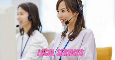 Two women in headsets are smiling while working at computers. The image has the words "LOCAL SERVICES" on it, representing the hyper-local business idea for women.