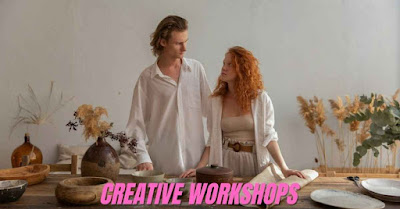 A man and a woman in a workshop with pottery and craft supplies on a table. The image has the words "CREATIVE WORKSHOPS" on it, representing a home-based business idea for women.