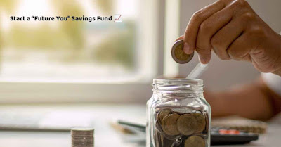 A person is dropping a coin into a glass jar labeled 'Future You Savings Fund'."