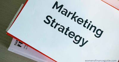 A notebook with the words 'Marketing Strategy' written on it, representing the strategic approach needed for affiliate marketing. This image illustrates how students can develop a plan to earn commission by promoting products online.